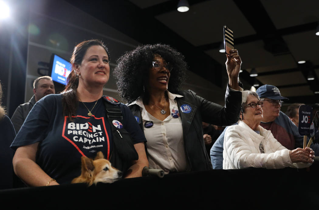 Supporters cheer for presidential candidate former Vice President Joe Biden speaks during a cau ...