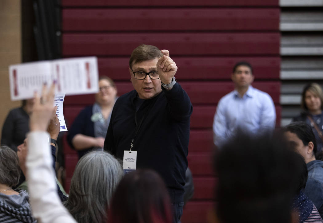 A precinct captain counts ballots at the Nevada caucus at Desert Oasis High School on Saturday, ...