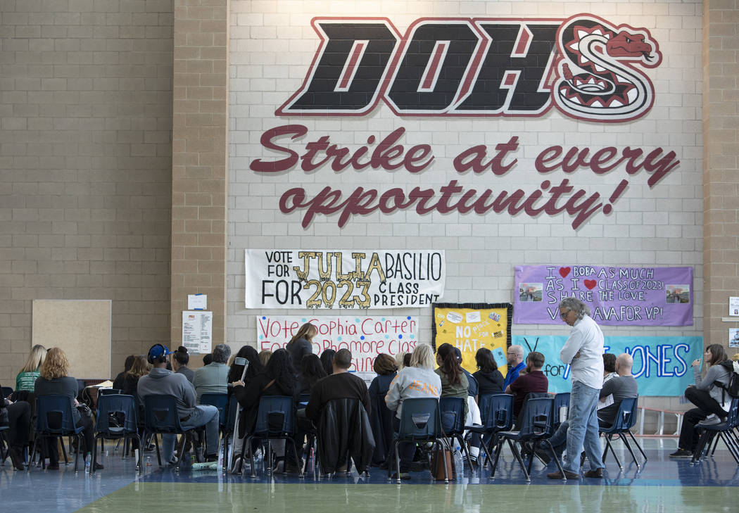 One group begins their first alignment during the Nevada caucus at Desert Oasis High School on ...