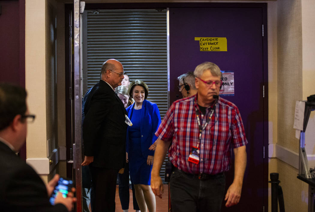 Democratic presidential candidate Sen. Amy Klobuchar, D-Minn., walks into the media spin room a ...