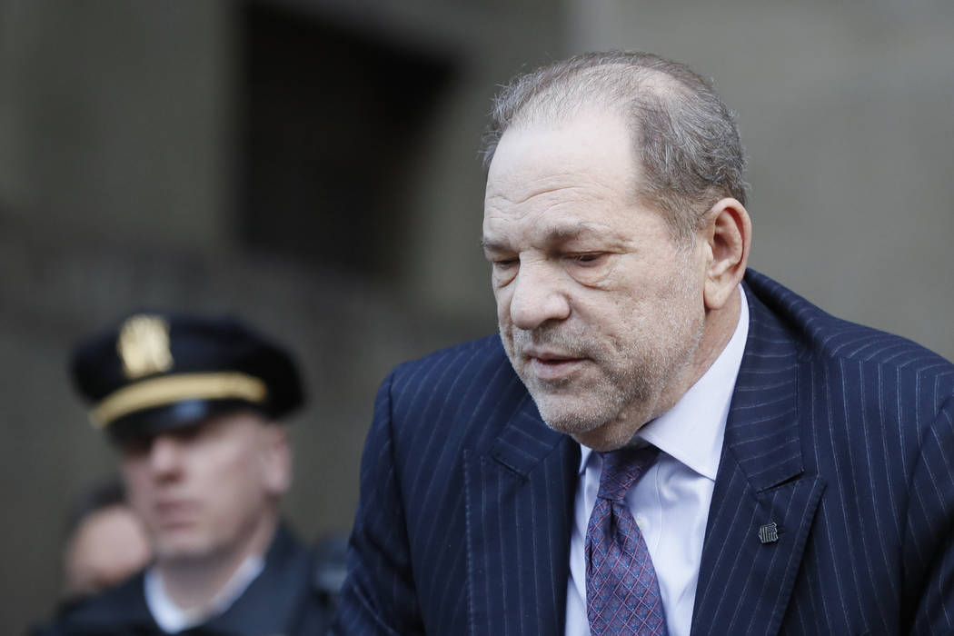 Harvey Weinstein leaves a Manhattan courthouse during his rape trial, Wednesday, Feb. 19, 2020, ...