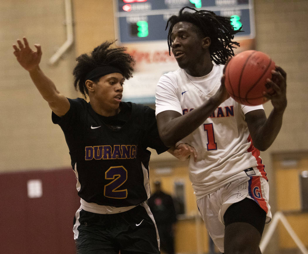 Durango's Elijah Johnson (2) defends against Bishop Gorman's Will McClendon (1) at Desert Oasis ...