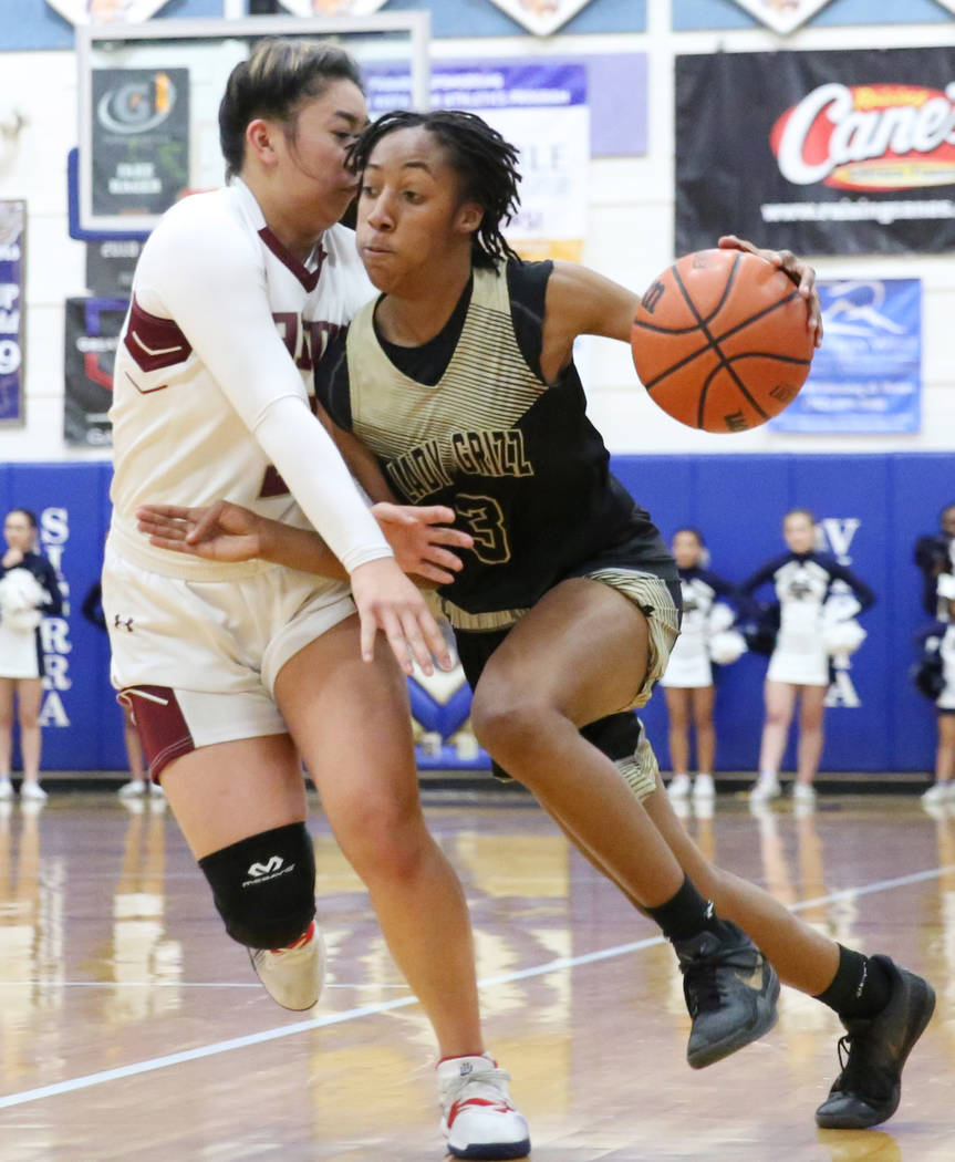 Faith Lutheran's Jalen Tanuvasa, left, defends Spring Valley's Aaliyah Gayles (3) during the se ...