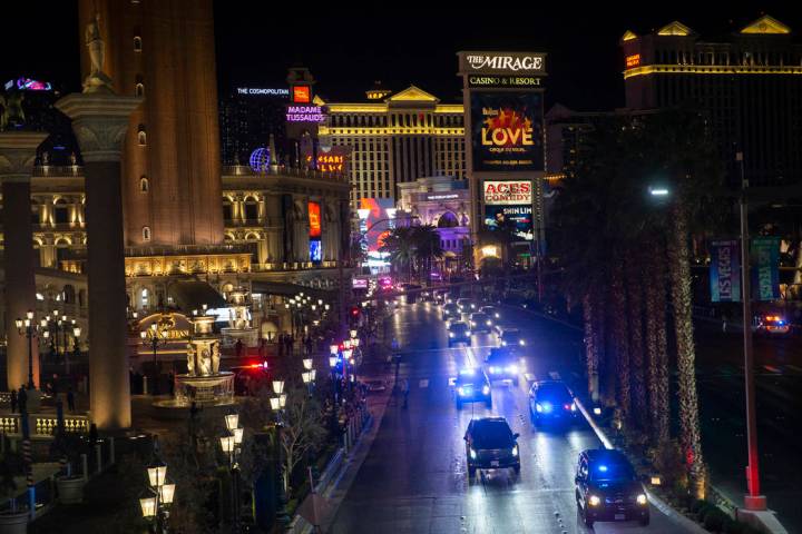 President Donald Trump, bottom/left, drives north on the Strip outside The Venetian with a ...