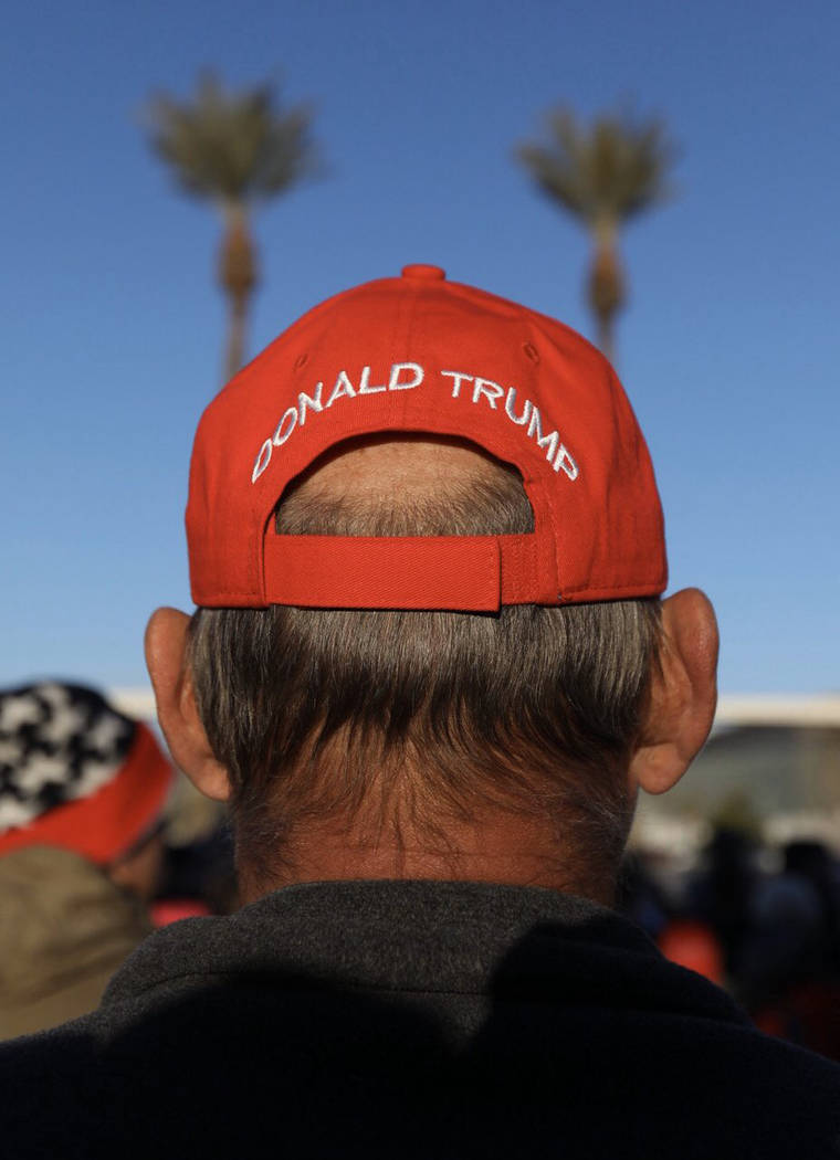A President Tump supporter waits in line before a campaign rally Friday, Feb. 21, 2020, in Las ...