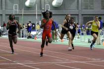 Bloomfield High School transgender athlete Terry Miller, second from left, wins the final of th ...