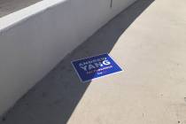 A campaign sign for former presidential candidate Andrew Yang now resides on a pedestrian walkw ...