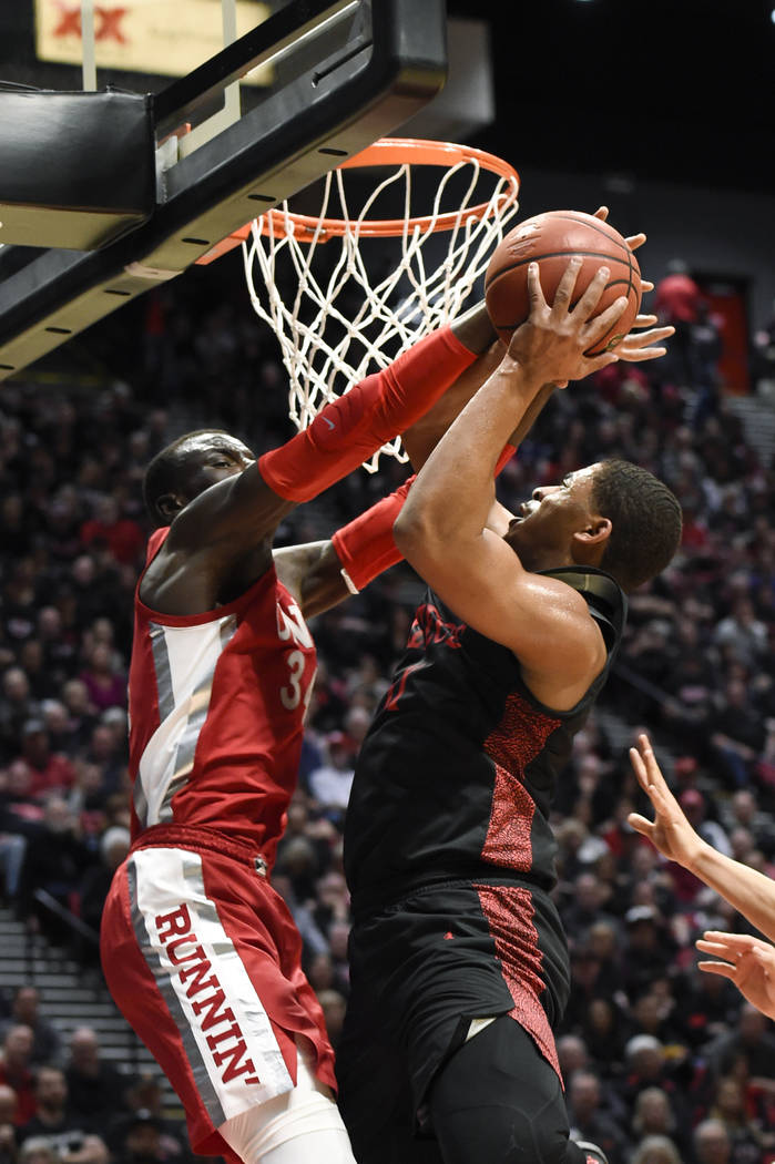 San Diego State forward Matt Mitchell, right, is fouled by UNLV forward Cheikh Mbacke Diong (34 ...
