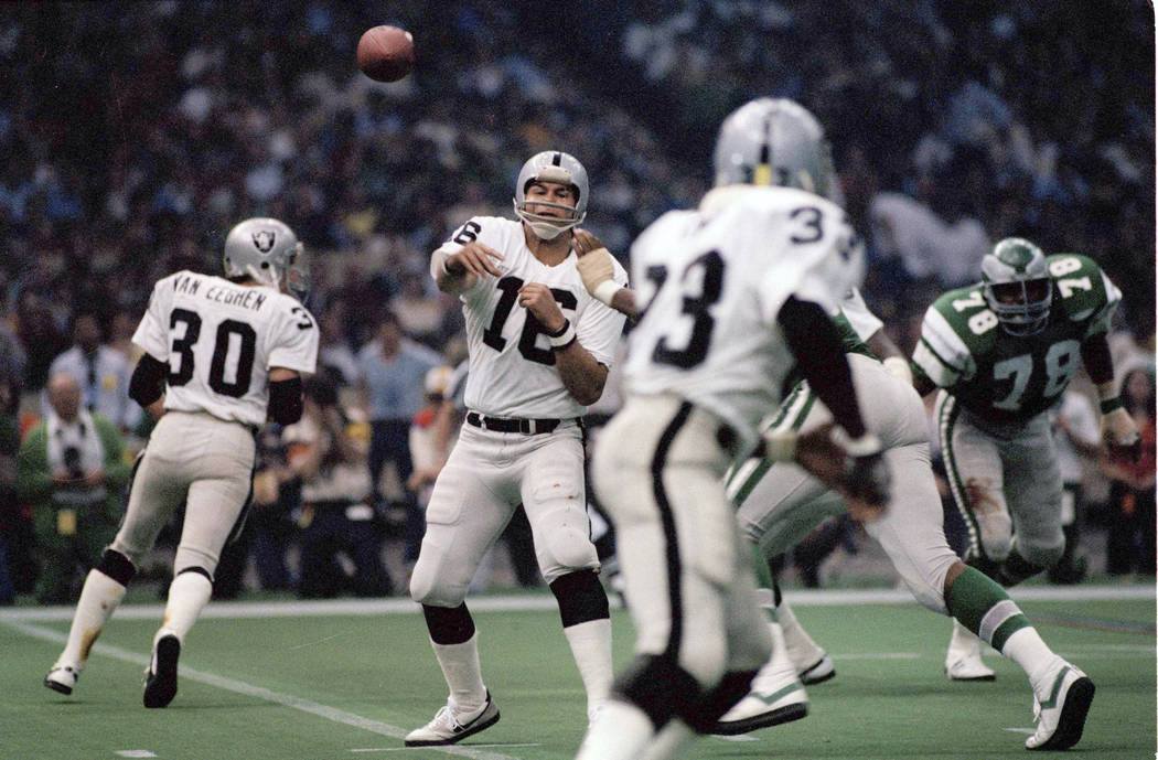 In this Jan. 25, 1981, Oakland Raiders quarterback Jim Plunkett (16) throws during NFL football ...