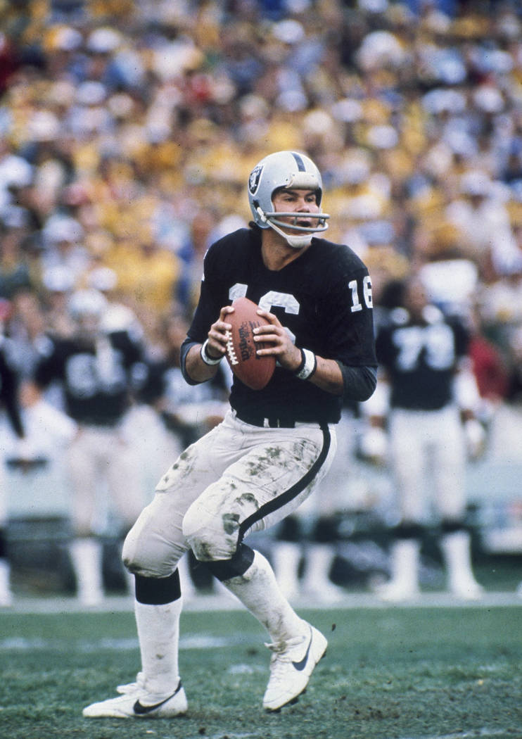 Oakland Raiders quarterback Jim Plunkett (16) prepares to throw the ball in a game against the ...