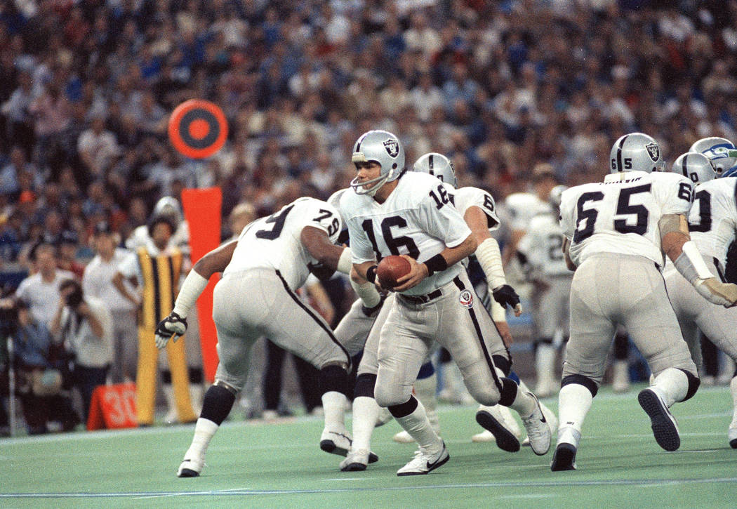 Los Angeles Raiders quarterback Jim Plunkett (16) in action against the Seahawks in Seattle, De ...