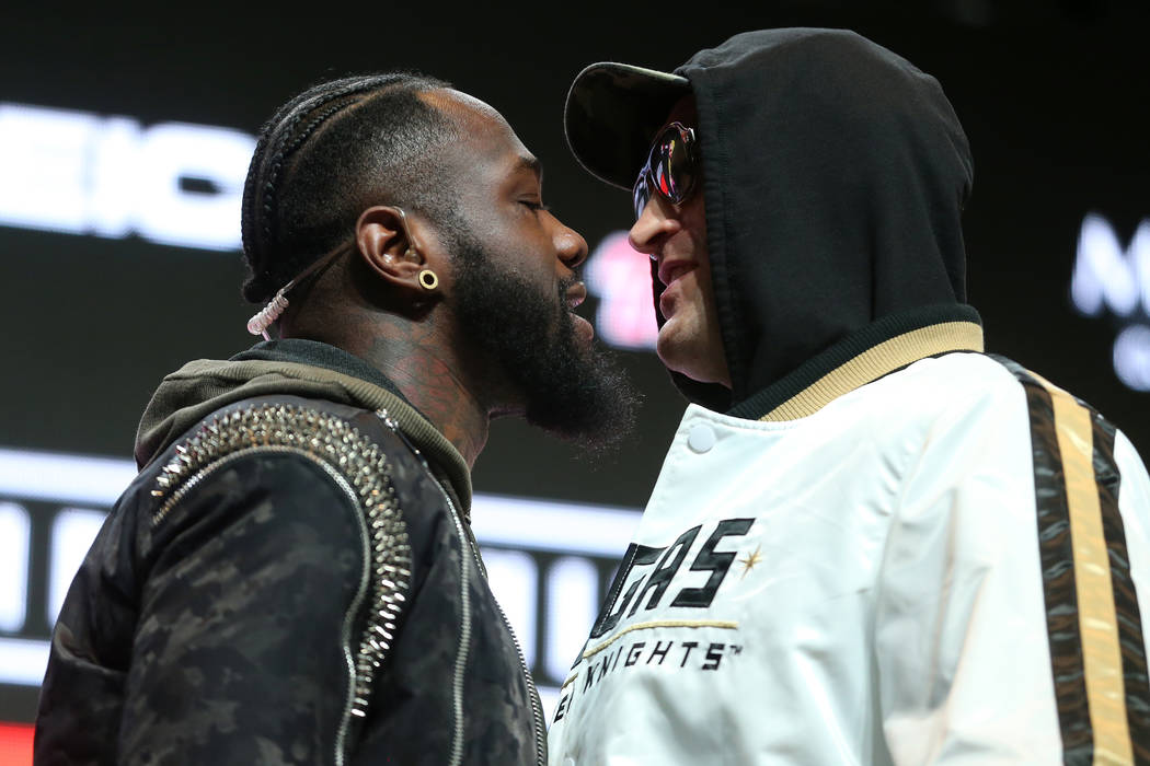 Deontay Wilder, left, and Tyson Fury, face off during a press conference at the MGM Grand Garde ...