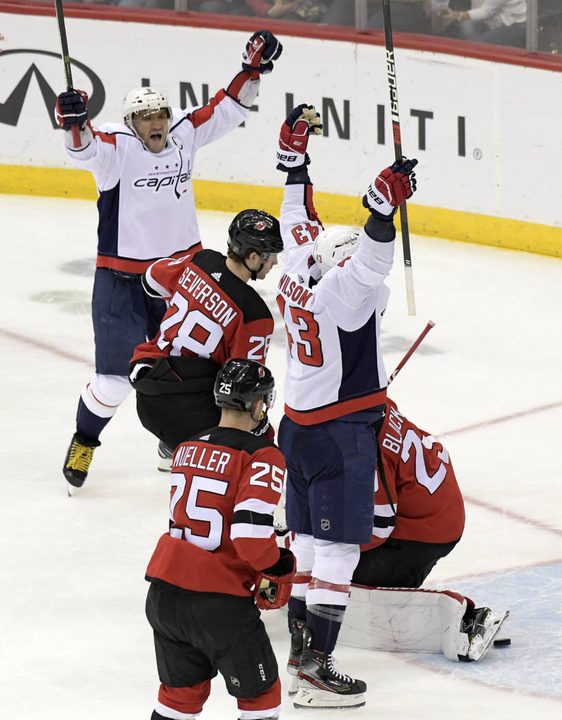 Washington Capitals right wing Tom Wilson (43) celebrates his goal with left wing Alex Ovechkin ...