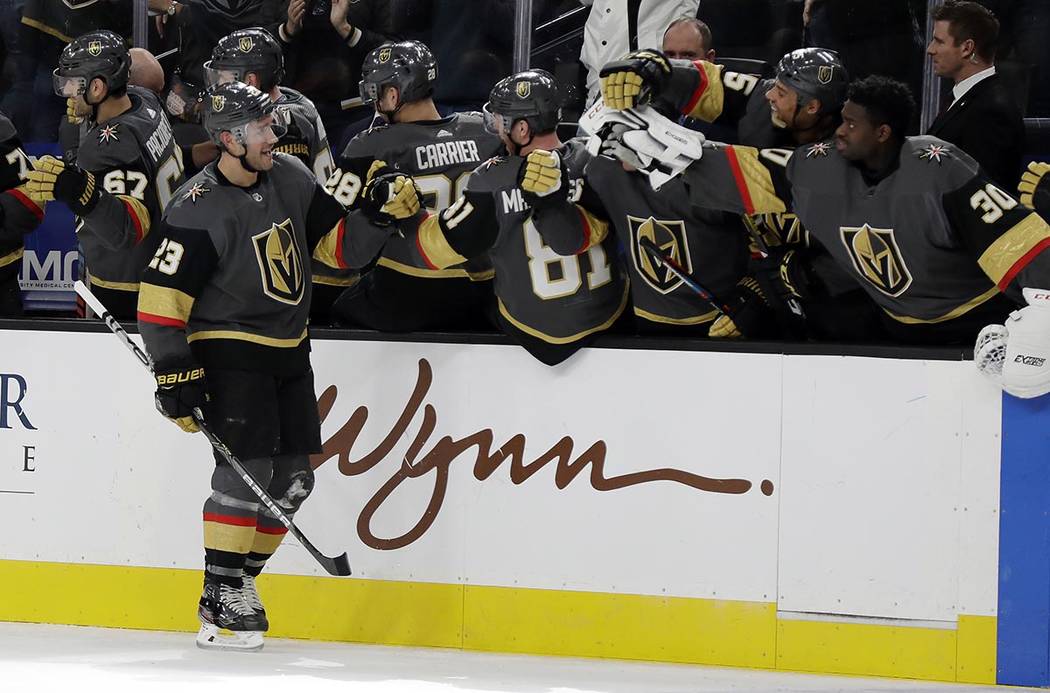 Vegas Golden Knights defenseman Alec Martinez (23) celebrates after scoring against the Tampa B ...