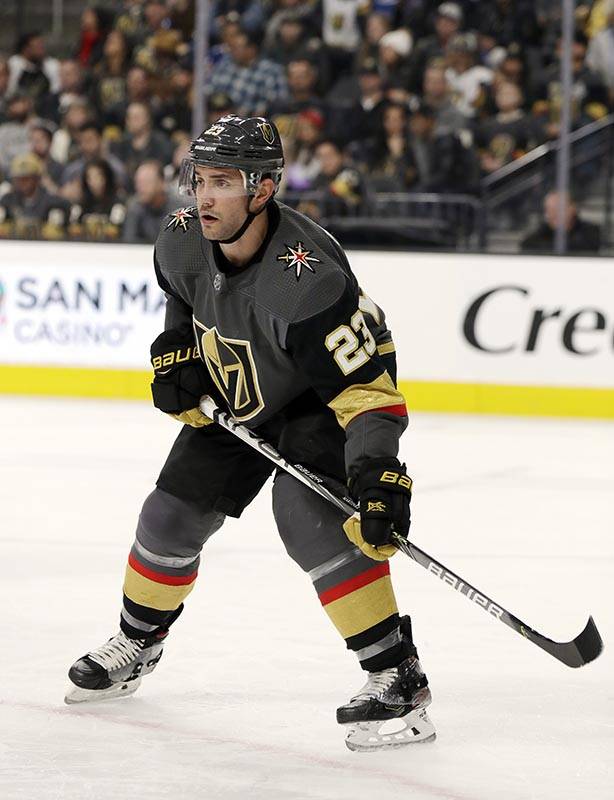 Vegas Golden Knights defenseman Alec Martinez, left, kicks a