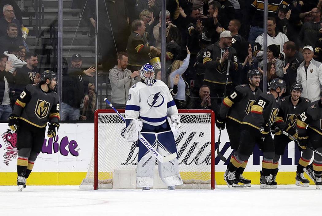 The Vegas Golden Knights celebrates after defenseman Alec Martinez (23) scored against Tampa Ba ...