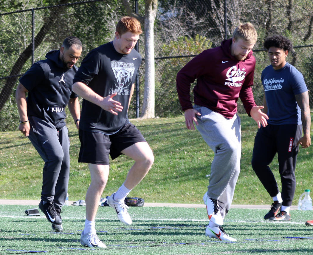 Former Stanford running back Cameron Scarlett, from left, former Montana safety Josh Sandry and ...