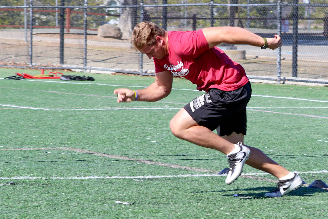 Former University of Wyoming linebacker Logan Wilson practices his starts for the 40-yard dash ...