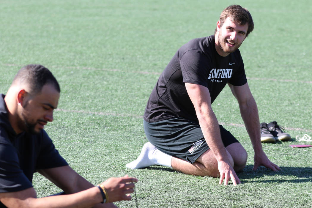 Former Stanford University outside linebacker Casey Toohill, right, stretches near former Stanf ...