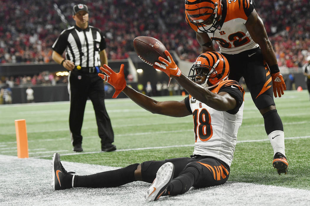 Cincinnati Bengals wide receiver A.J. Green (18) celebrates his game-winning catch against the ...