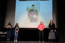 Lisa Casey, far right, mother of fallen U.S. Army Chief Warrant Officer Kirk T. Fuchigami, spea ...