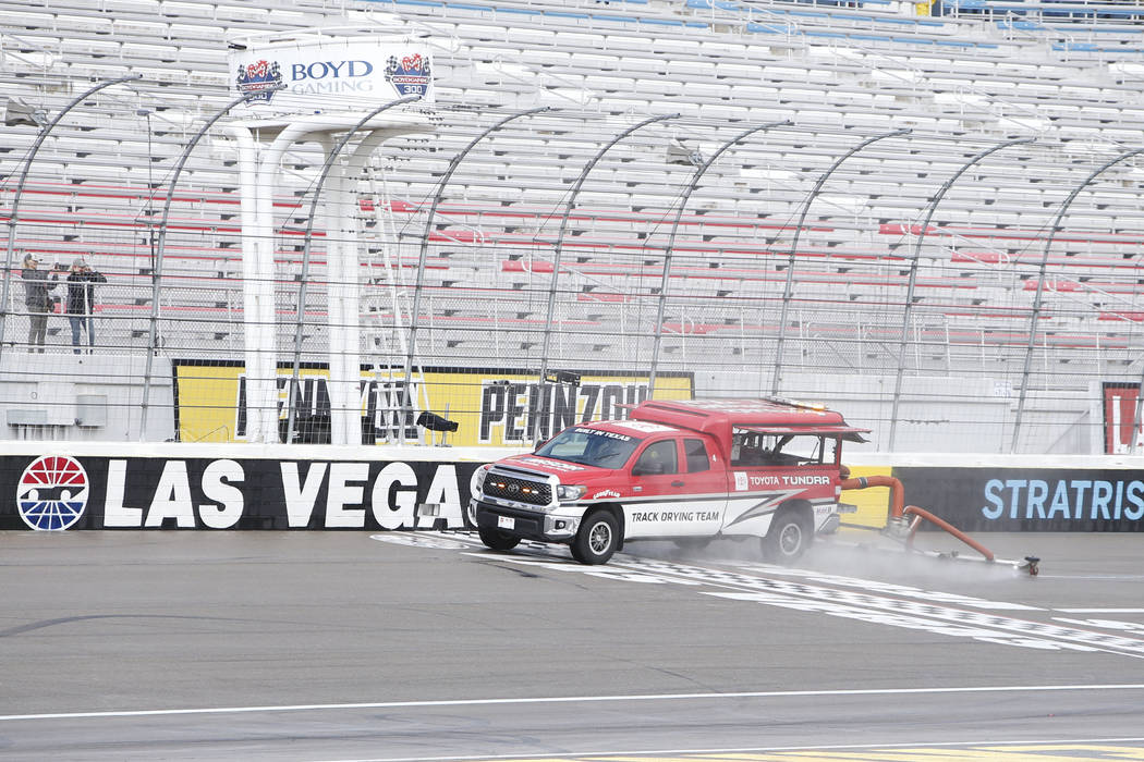 LAS VEGAS, NV - FEBRUARY 22: A jet dryer attempts to dry the track after a rain delay before th ...