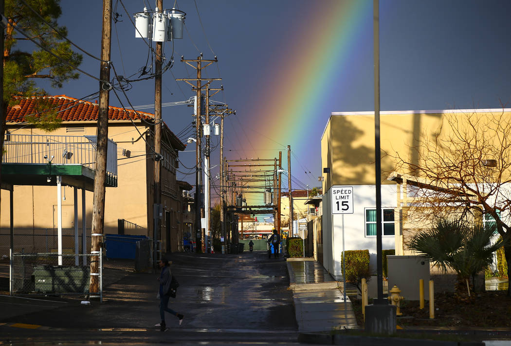 A rainbow rises above Maryland Parkway after rain in downtown Las Vegas on Saturday, Feb. 22, 2 ...
