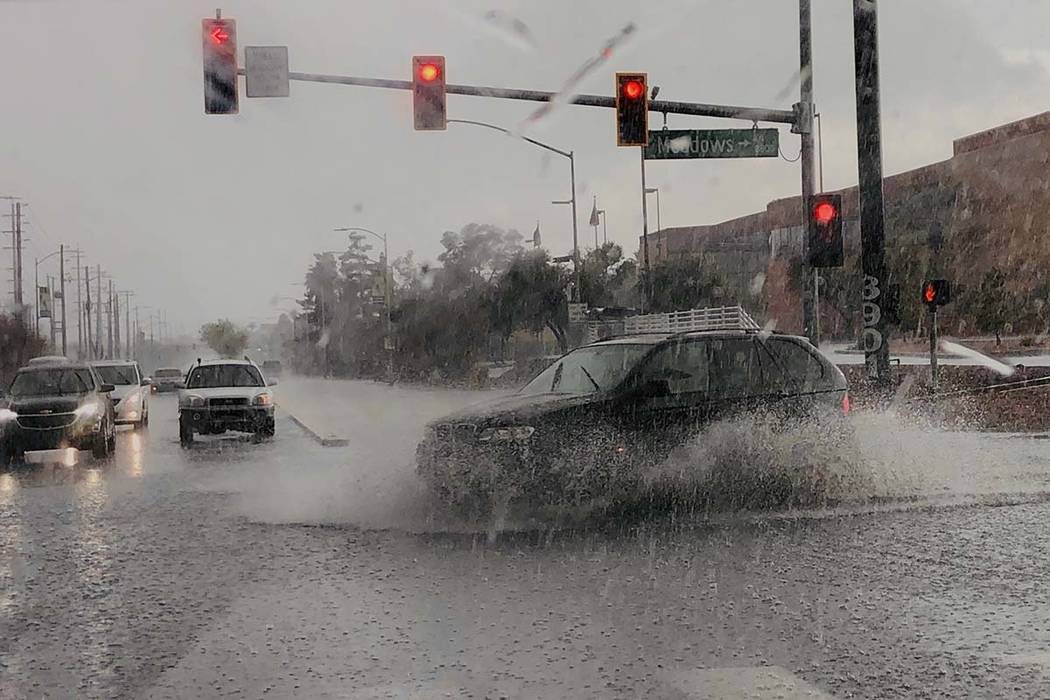 Rain pours down in Las Vegas at Valley View Boulevard and Meadows Lane, Saturday afternoon, Feb ...