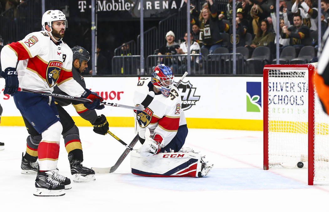 Golden Knights' Tomas Nosek, not pictured, sends the puck past Florida Panthers goaltender Sam ...