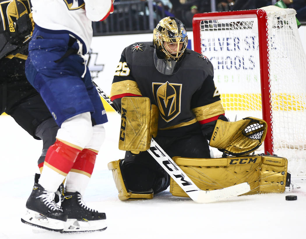 Golden Knights goaltender Marc-Andre Fleury (29) stops the puck from the Florida Panthers durin ...