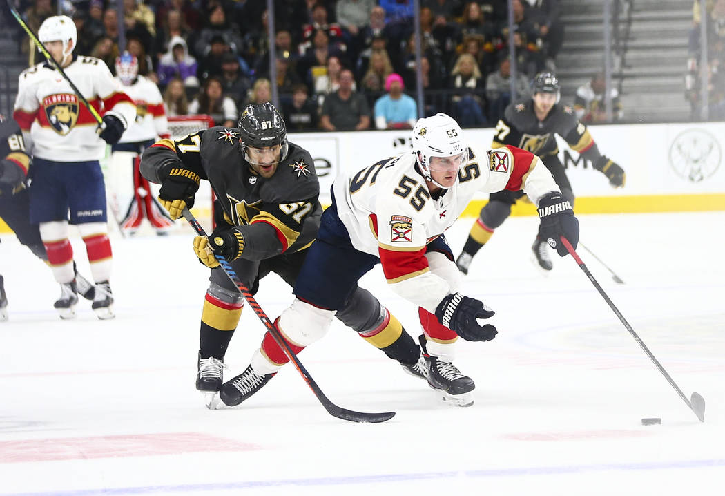 Florida Panthers' Noel Acciari (55) skates with the puck as Golden Knights' Max Pacioretty (67) ...