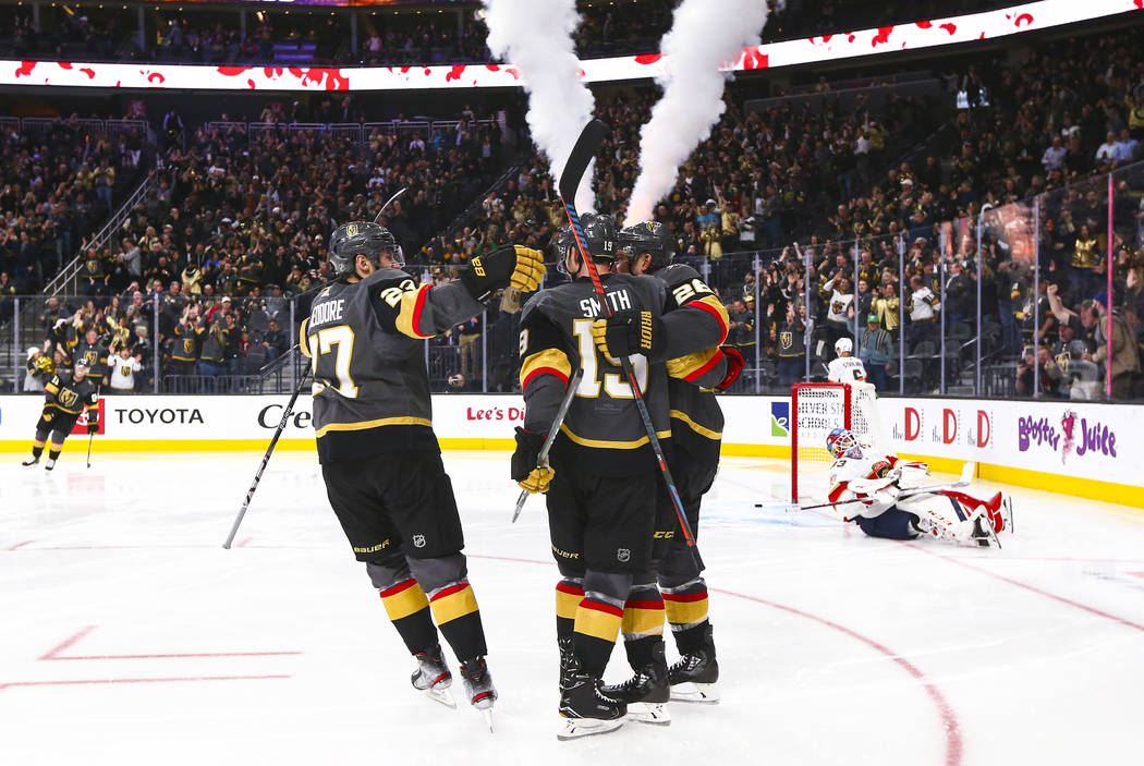Golden Knights' Reilly Smith (19) celebrates with teammates after scoring past Florida Panthers ...