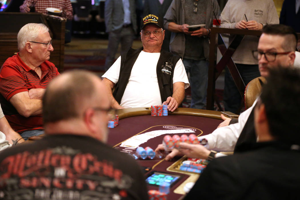 Earl McKee, left, of Canada, and Dan Shubin, of Las Vegas, participate in the first game of pok ...