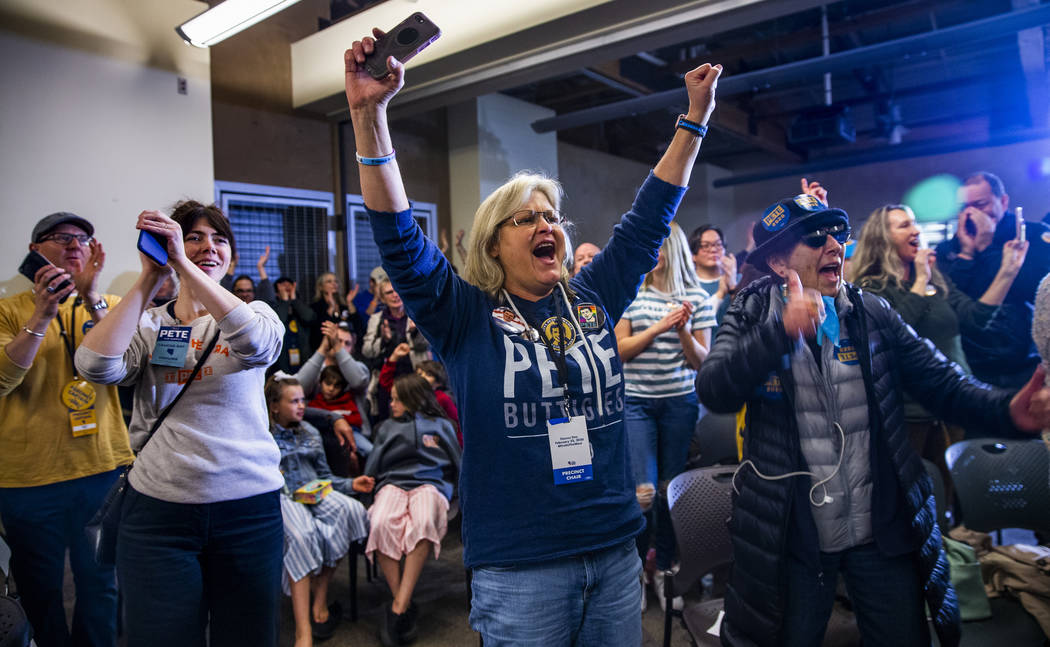 Crowd members cheer as Democratic presidential candidate and former South Bend, Ind., Mayor Pet ...