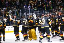 Golden Knights players celebrate after defeating the Florida Panthers in an NHL hockey game at ...