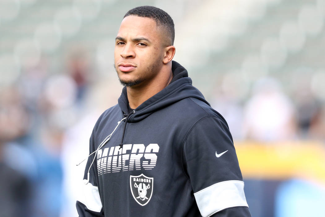 Oakland Raiders defensive back Johnathan Abram walks on the field before an NFL game between th ...