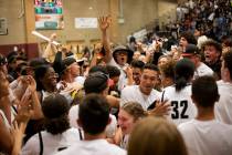 Desert Oasis fans storm the court after their girls basketball team won 67-55 against Spring Va ...