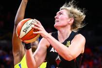 Las Vegas Aces' Carolyn Swords goes to the basket against Dallas Wings' Kaela Davis during the ...