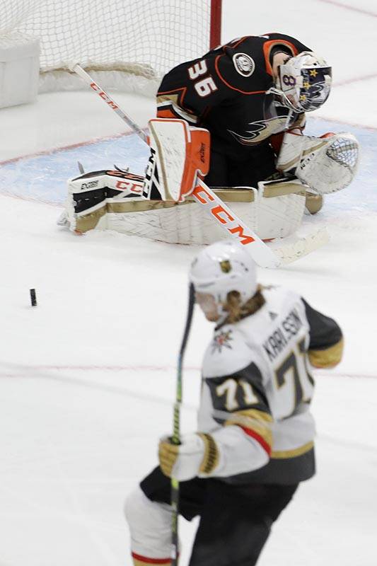 Vegas Golden Knights center William Karlsson, bottom, celebrates after scoring past Anaheim Duc ...