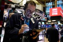 Trader Gregory Rowe works on the floor of the New York Stock Exchange, Monday, Feb. 24, 2020. S ...