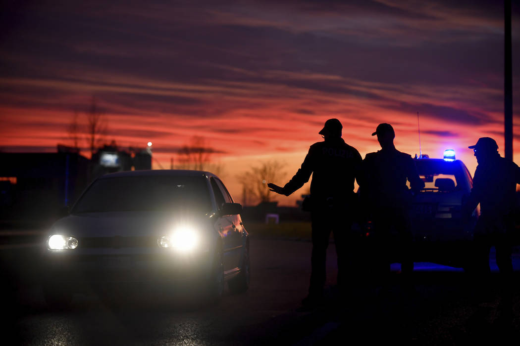 Police stops cars trying to enter or leave the cordoned area in Casalpusterlengo, Northern Ital ...