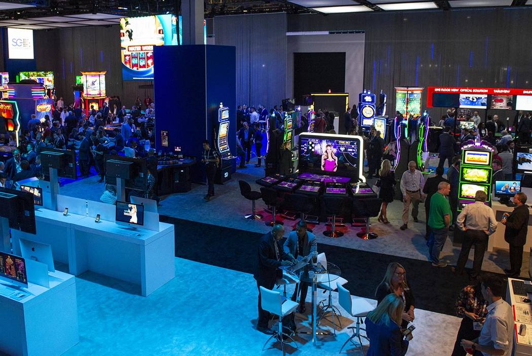 Scientific Games showcases their new games and technology behind a wall surrounding the booth t ...