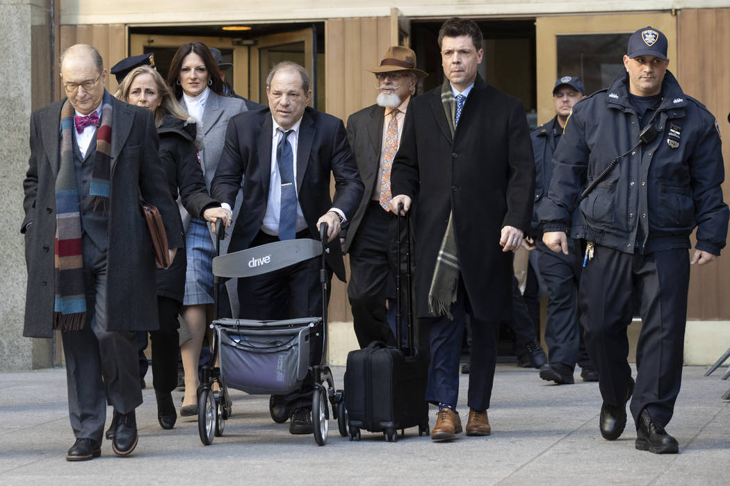 Harvey Weinstein, fourth from left, leaves the courthouse during jury deliberations in his rape ...