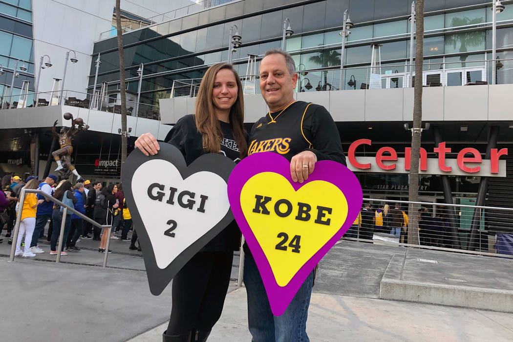 Alyssa Shapiro, 27, of Huntington Beach, and her father Rick Shapiro, 55, stand outside Staples ...