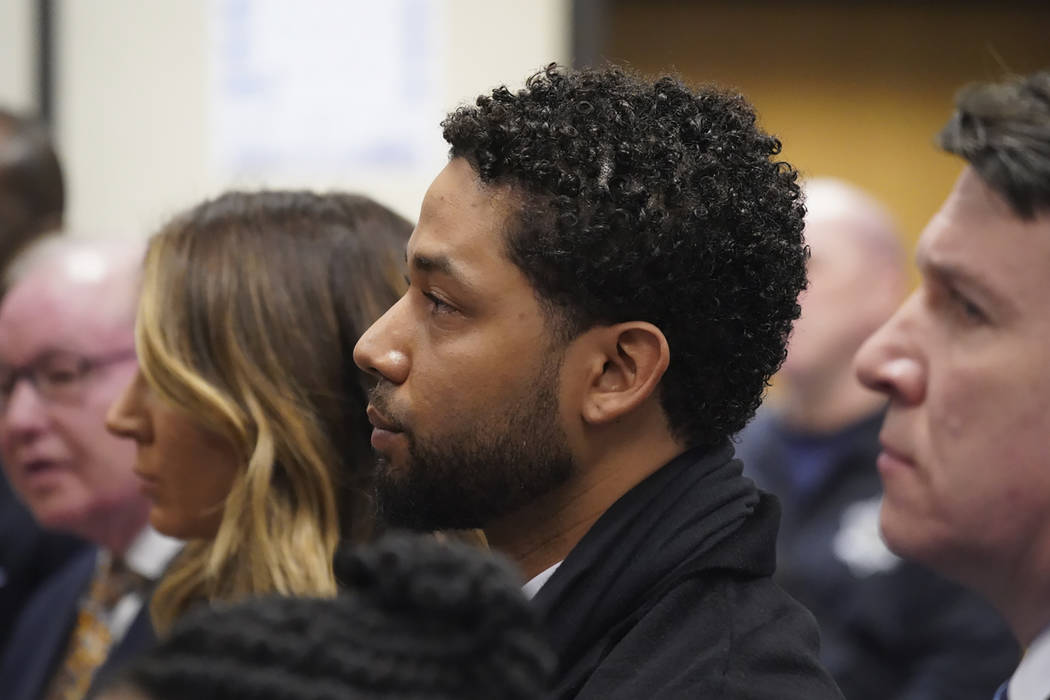 Actor Jussie Smollett, center, appears in a courtroom at the Leighton Criminal Court Building i ...