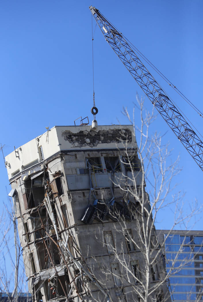 A wrecking ball smashes against the "Leaning Tower of Dallas" north of downtown Dalla ...