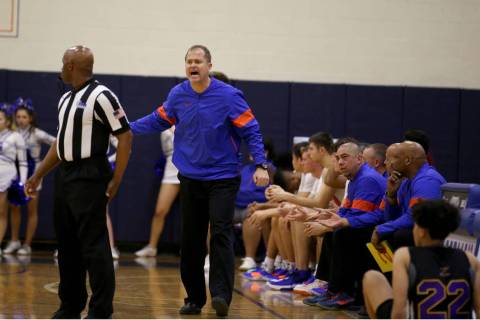 Bishop Gorman head coach Grant Rice argues a call in the third quarter of their basketball game ...