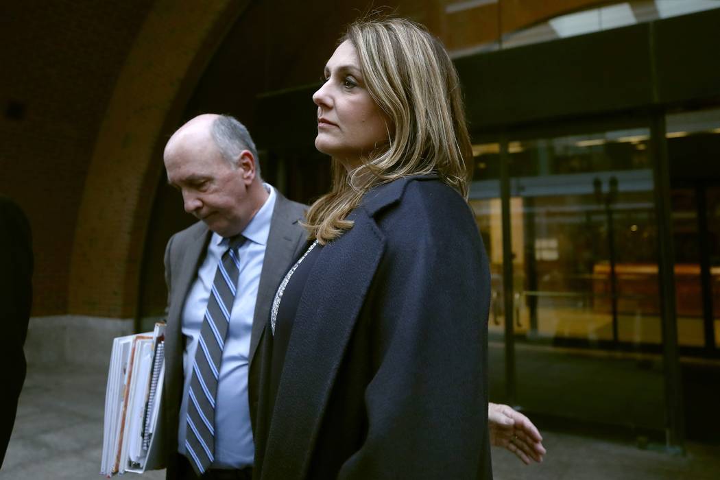 Michelle Janavs stands with attorney Thomas Bienert outside federal court, Tuesday, Feb. 25, 20 ...