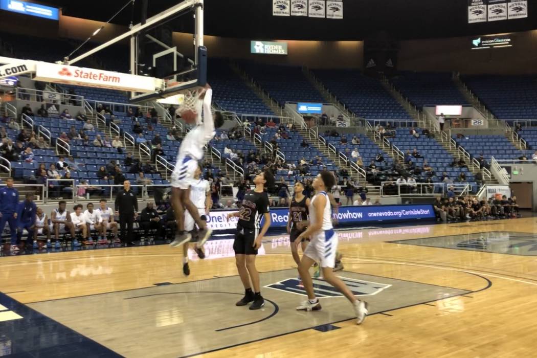 Desert Pines junior guard Dayshawn Wiley dunks during the second half of a 72-50 victory over D ...