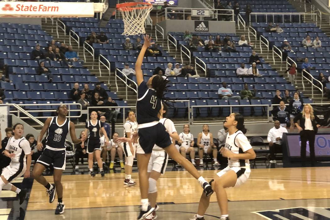 Centennial junior guard Taylor Bigby makes a layup during the first quarter of the Class 4A sta ...